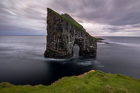 Drangarnir is the collective name of two sea stacks, which are called Stri Drangur (large rock) and Ltli Drangur (small rock) respectively, and are located next to each other between the islands of Vgar and Tindhlmur, Srvgsfjrur Fjord near Srvgur, Faeroe islands, Denmark